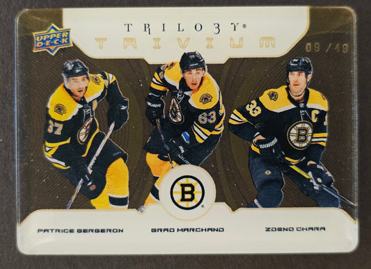 Bergeron/Marchand/Chara Trivium /49 - 2023/24 Trilogy