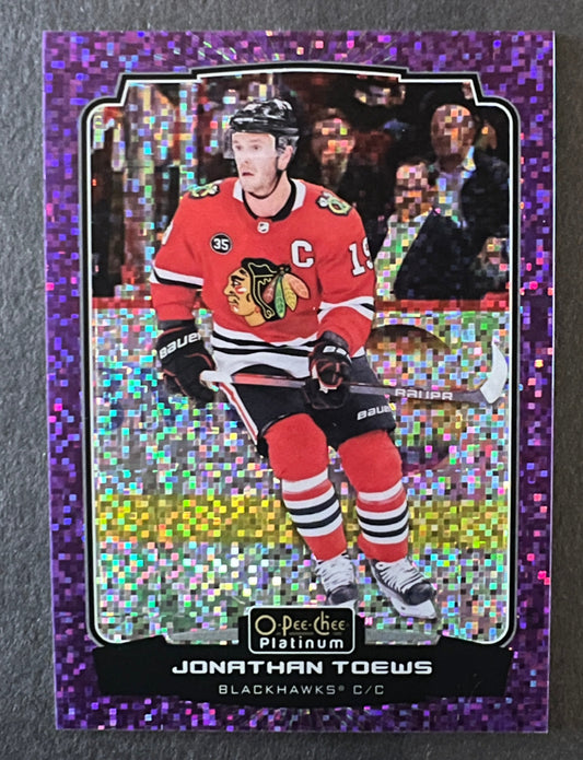 Jonathan Toews #155 Violet Pixels /299 - 2022/23 O-Pee-Chee Platinum